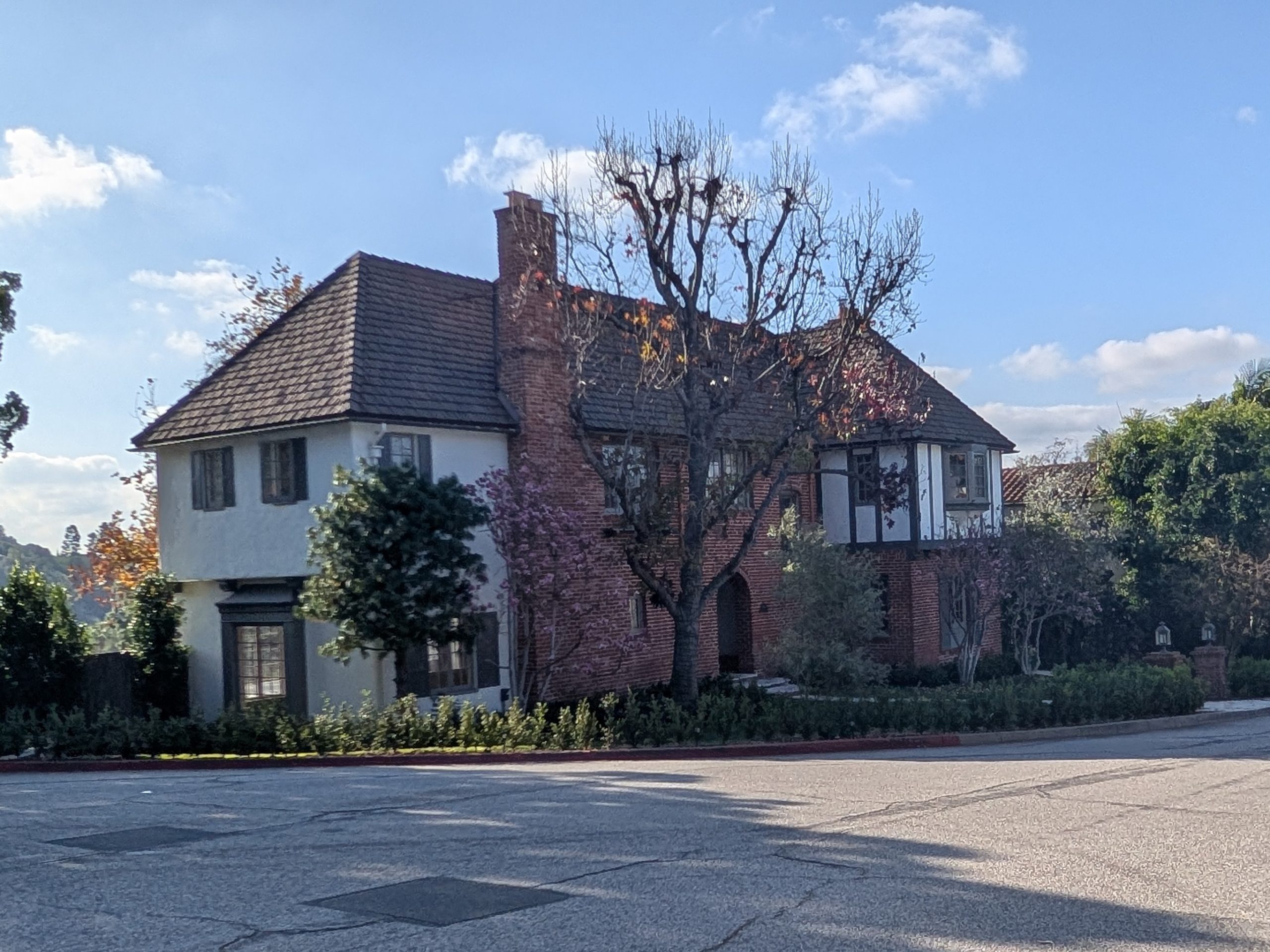 Two-story Tudor-style character home on a residential corner in the Verdugos