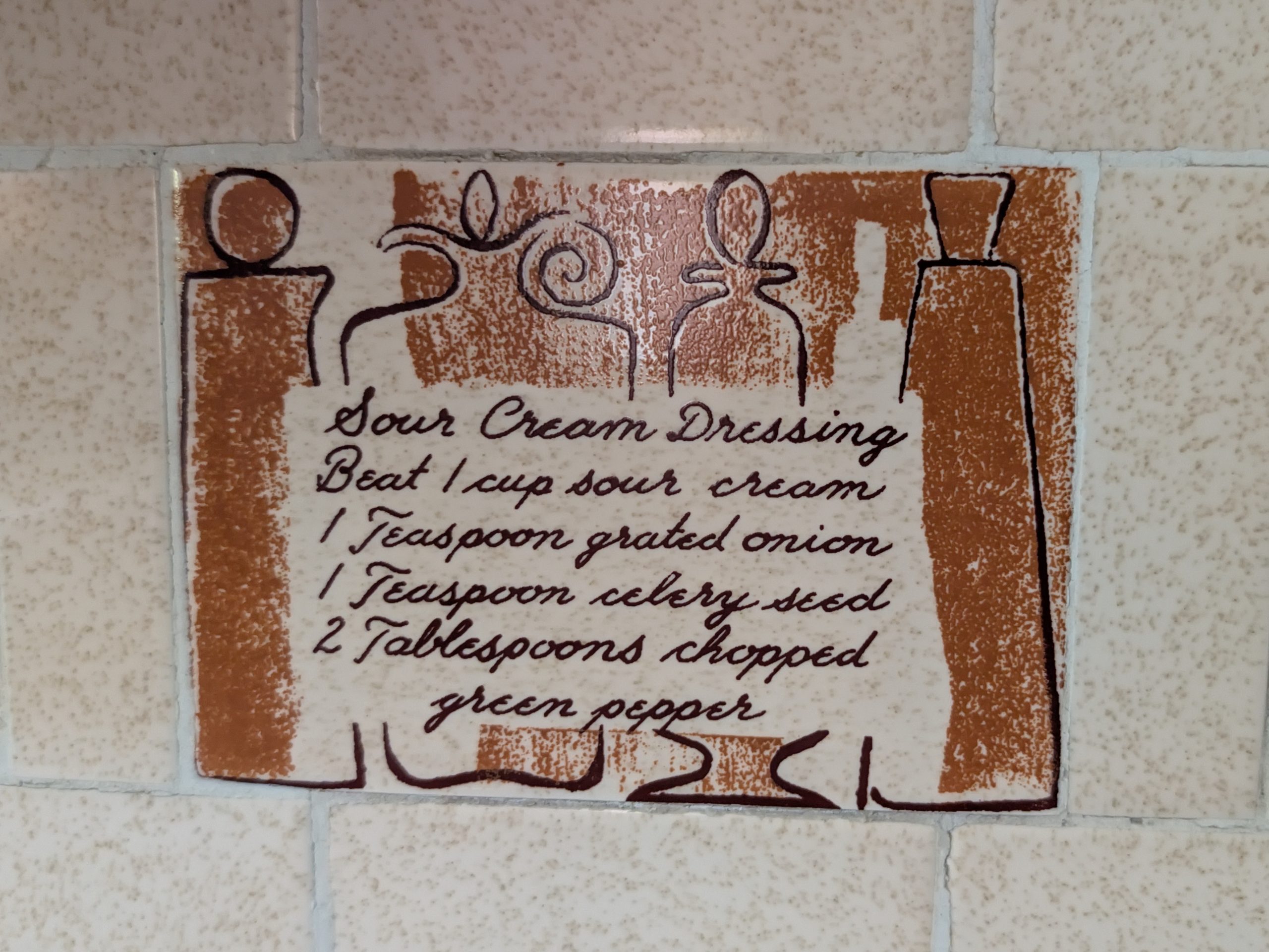 Vintage recipe tile preserved as an original architectural detail in an older home